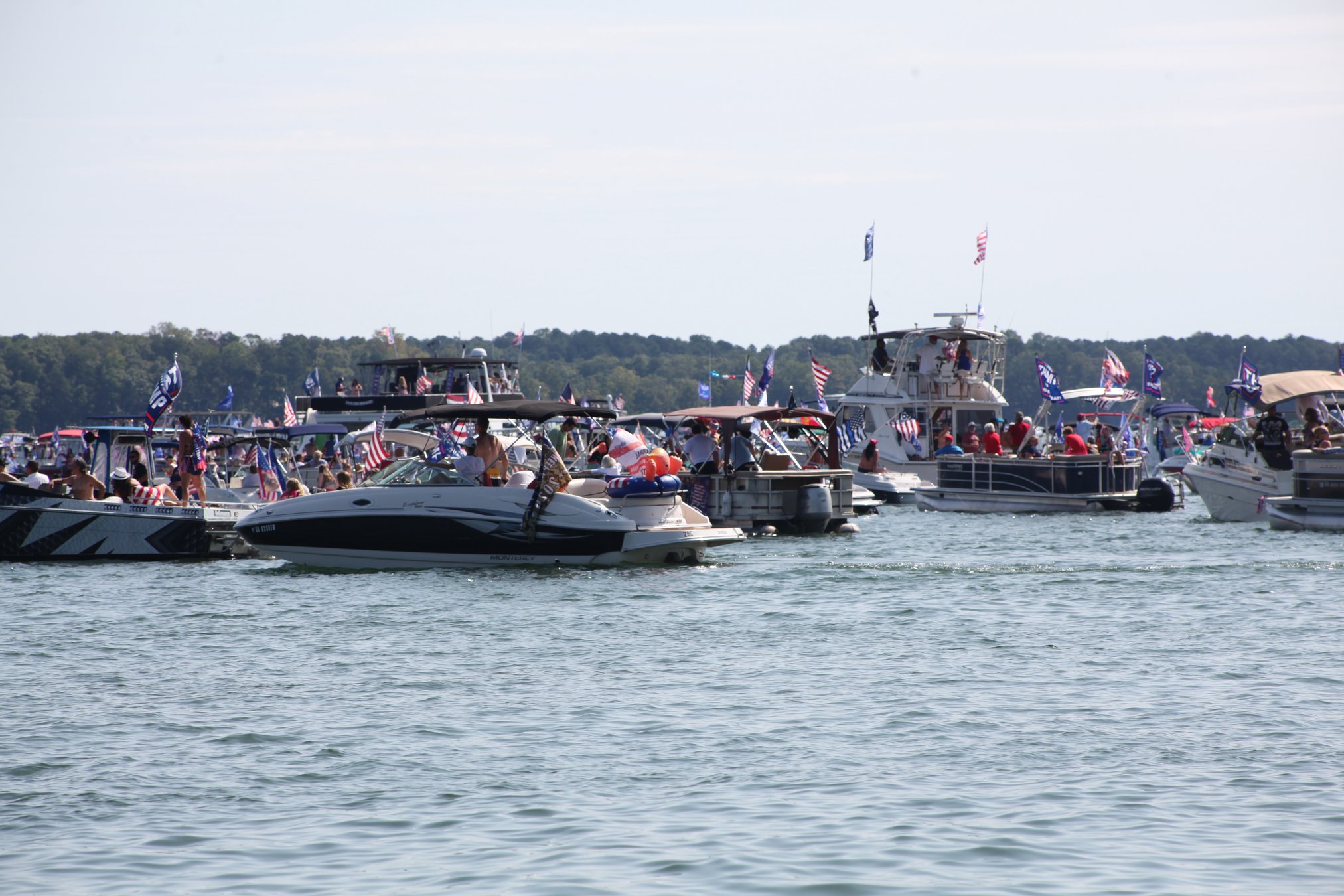 Boats navigating through crowded waters on a busy summer day at Lake Lanier.