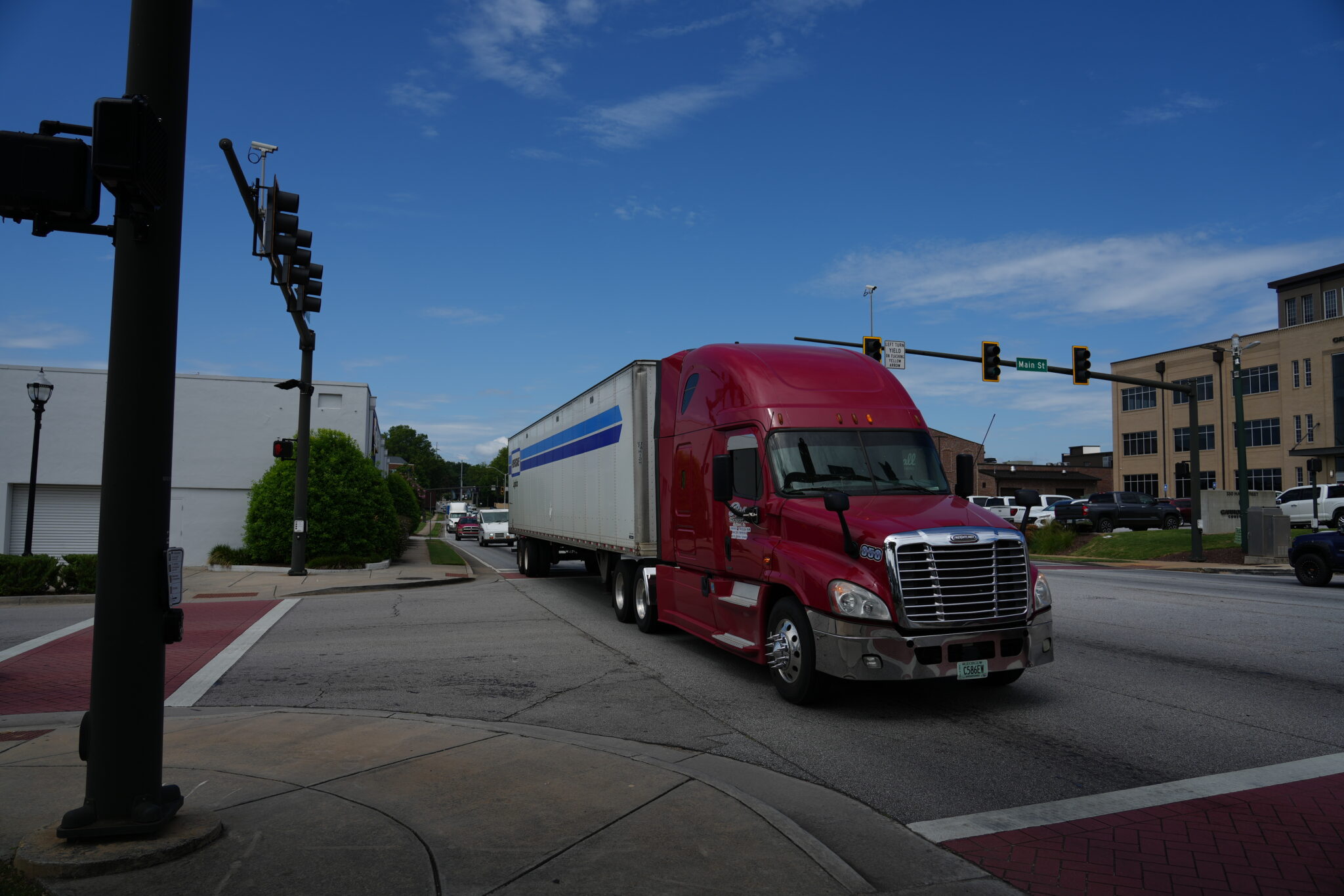 Trucks crossing intersection at Jesse Jewell Parkway and Main Street in Gainesville GA